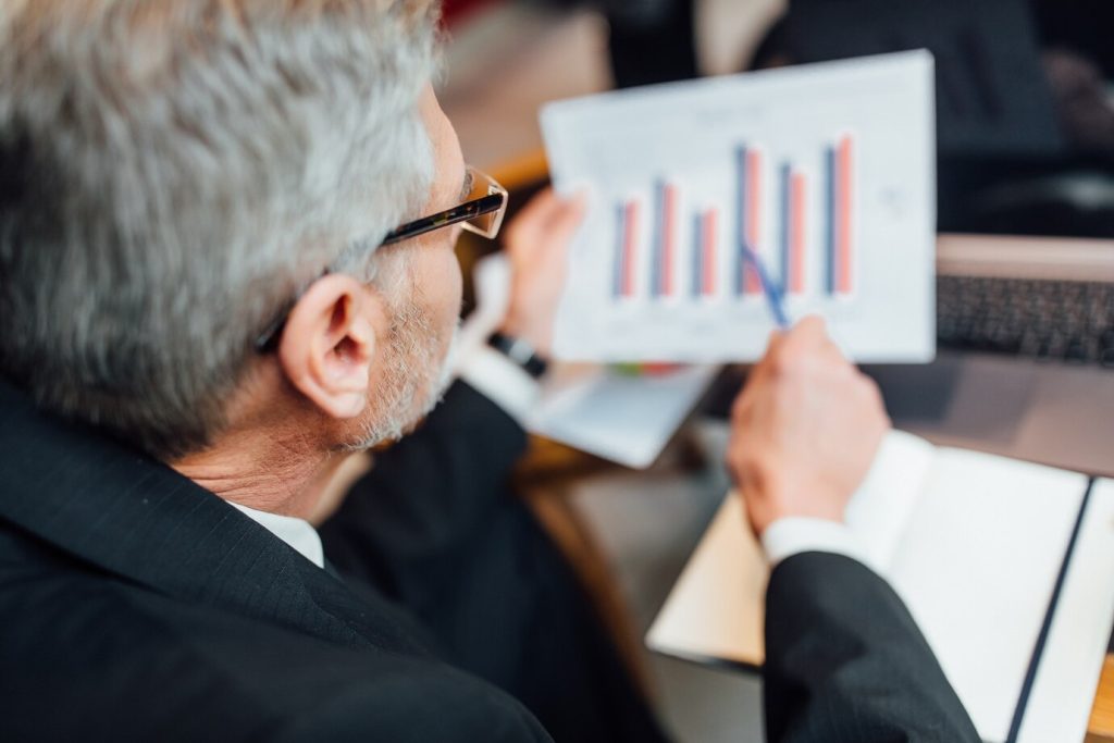 Business advisor analyzing financial data and market trends.